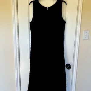 Sleeveless black dress.